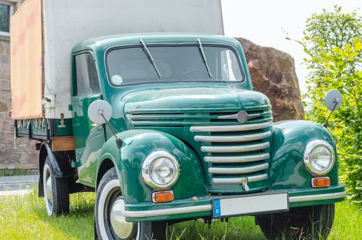 Rheine, Germay - March 13 2014:In Rheine on the main road out of town. Old truck parked on the street, to advertising. Oldtimer constructed from the year 1954 to 1961 in the former GDR in the VEB Barkas works Karl Marx Stadt. 
This three-quarter-ton truck is the smallest of the former GDR have been.
