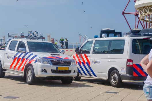 Den Haag,Scheveningen Pier, Niederlande - August 07. 2014: Occupation and protest by squatters on Thursday morning 07.2014. The pier was cleared of about 15 squatters by a police operation and the attached banners were removed. 
Der1961 opened Pier was closed in December 2012 because he did not meet the safety requirements. Since then, an investor / buyer is sought.