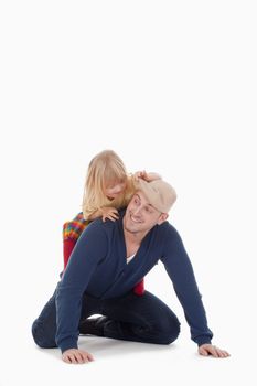 boy with long blond hair riding on fathers back - isolated on white
