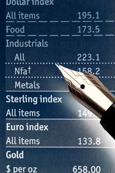 extreme closeup of a fountain pen and charts