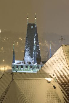 prague - winter view of lesser town rooftops covered with snow