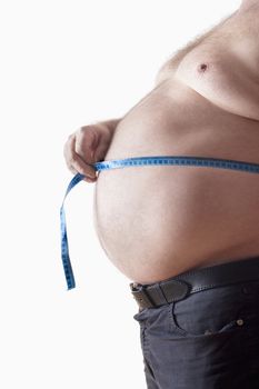 big belly of a fat man and measuring tape isolated on white