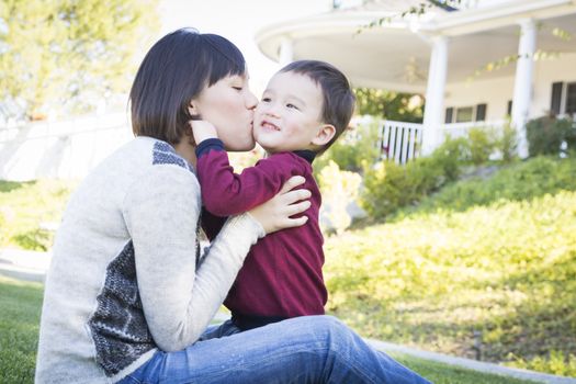 Happy Chinese Mother Having Fun with Her Mixed Race Baby Son.