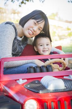 Happy Chinese Mother Having Fun with Her Mixed Race Baby Son.