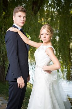 Beautiful wedding couple is enjoying wedding in the sun. 