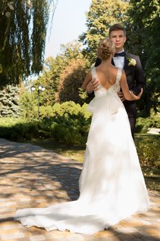 Beautiful wedding couple is enjoying wedding in the sun. 