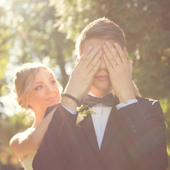 Beautiful wedding couple is enjoying wedding in the sun. 