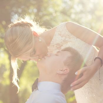 Beautiful wedding couple is enjoying wedding in the sun. 