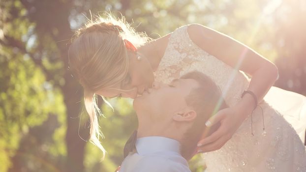 Beautiful wedding couple is enjoying wedding in the sun. 