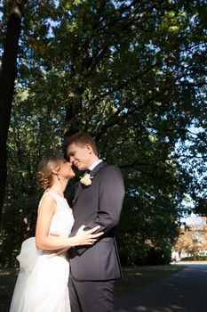 Beautiful wedding couple is enjoying wedding in the sun. 