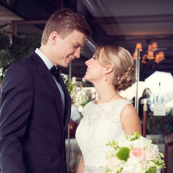 Beautiful wedding couple is enjoying wedding in the sun. 