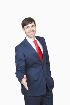 business executive in suit stretching out his hand for handshake