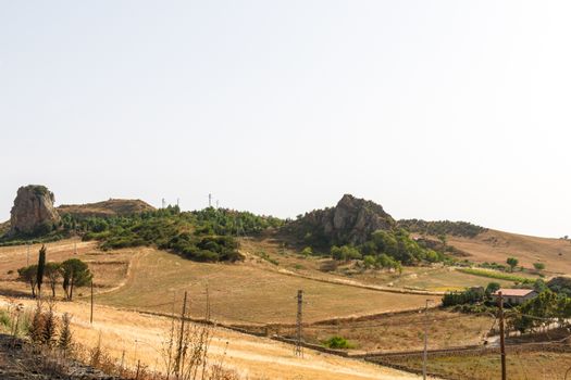 Sicilian landscape in summer with dry grass