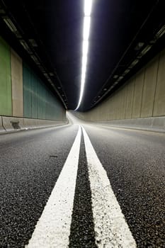 Interior of an urban tunnel without traffic in hong kong modern city at night