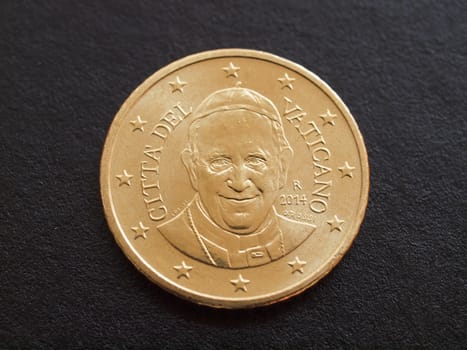 Fifty Euro cent coin from Vatican City bearing the portrait of Pope Bergoglio Francis I isolated over black background