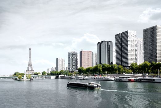 Paris, barge on the Seine and Eiffel tower, view from a bridge