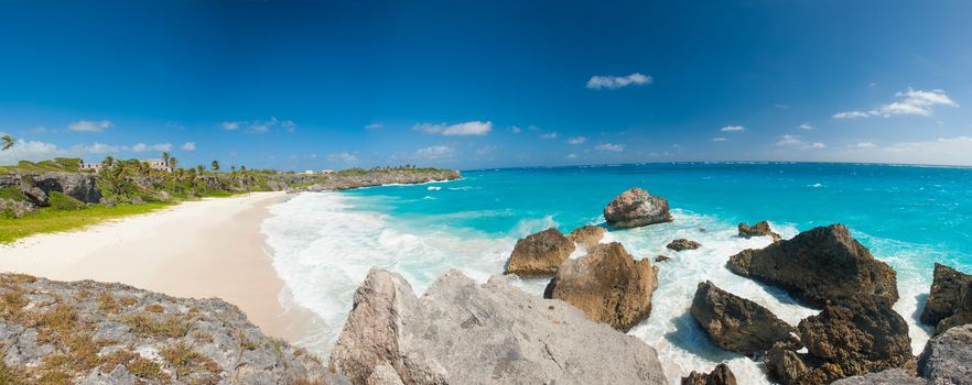 Harrismith Beach is one of the most beautiful beaches on the Caribbean island of Barbados. It is a tropical paradise with palms hanging over turquoise sea and a ruin of an old mansion on the cliff