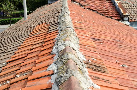 Old roof red tiles close view exterior