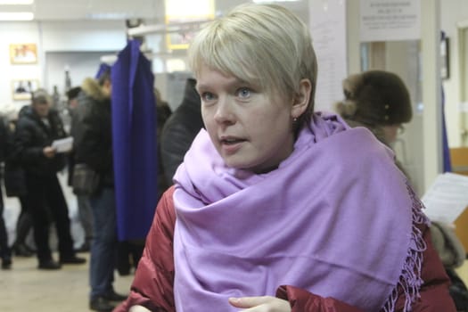 Moscow, Russia - March 4, 2012. Elections in Russia. Policies Evgeniya Chirikova communicates with observers at the polling station