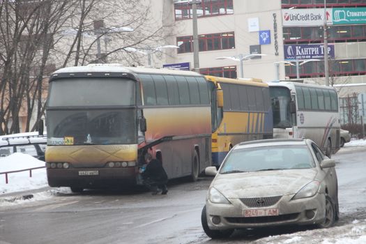 Moscow, Russia - March 4, 2012. Electoral fraud in Russia. A bus with people from the authorities, who vote at multiple polling stations simultaneously