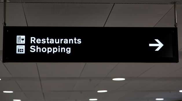 Airport info board in terminal with guiding information