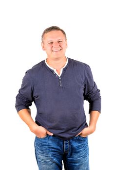 Casually dressed middle aged man smiling. 3/4 view of man shot in vertical format isolated on white.