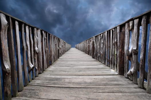 Old wooden bridge leading to the unknown