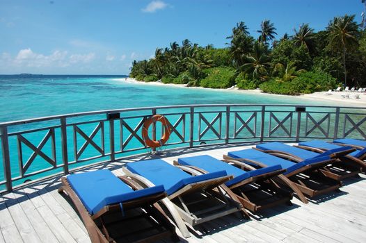 Sunbed at timber pier, Maldives, Bandos Island