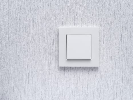 Light switch / White light switch on white wall / Concept / On Off