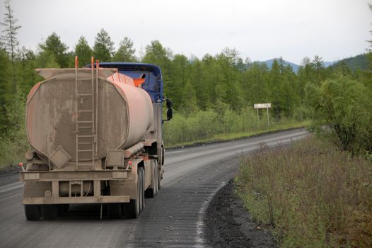 Fuel truck at gravel road Kolyma highway at Yakutia, Russia