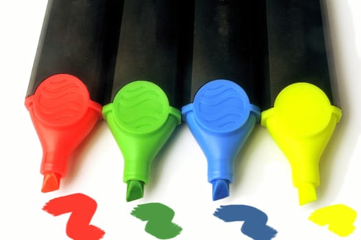 Highlighters blue, green, red and yellow on white background