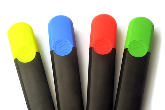 Highlighters blue, green, red and yellow on white background