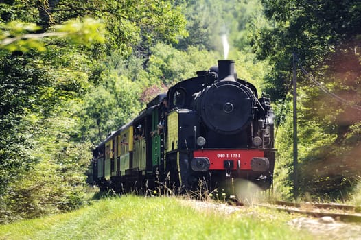 The tourist train from Anduze in the countryside arriving at Massies where he does not stop.