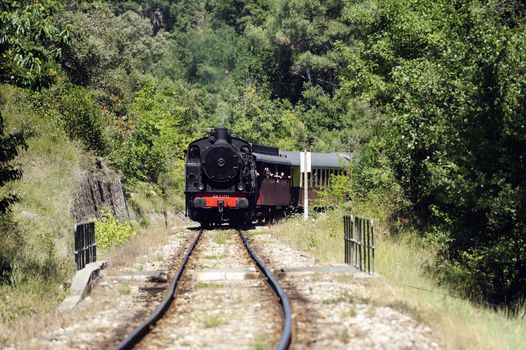 Little tourist steam train from Anduze going to Saint-Jean-du-Gard and just passed the viaduct Corbes