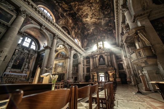 Sun Rays Beaming Through The Old Glass Window of Church, Italy