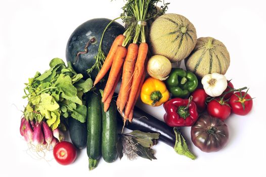 crates of fruit and vegetables on white background in studio.