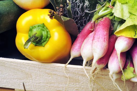 crates of fruit and vegetables on white background in studio.