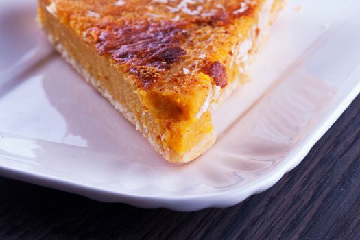 Pumpkin cake slice over a white plate