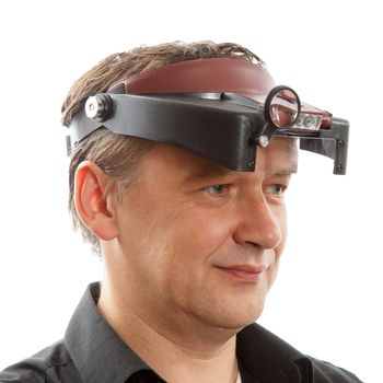 Jeweler with a Headband Magnifying Glasses on White Background