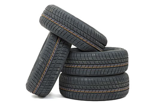 Many car tyres in a pile