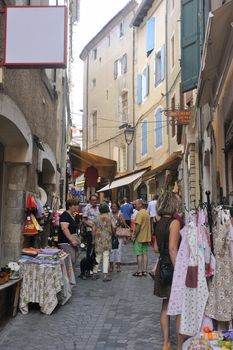 clothing store in Anduze pedestrian street, where tourists love to walk around and buy souvenirs from vacation.
