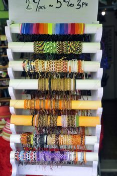 Display fancy bracelets in a souvenir shop in the pedestrian street of Anduze