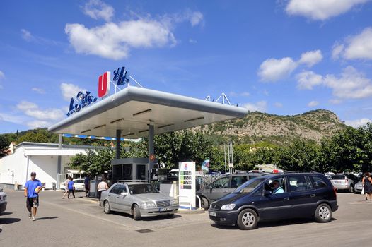 Service station on a French supermarket car park where the prices are generally lower than in a normal station.