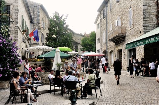 Summer terraces breweries are installed in the streets of the old village of Vezenobres in the French department of Gard