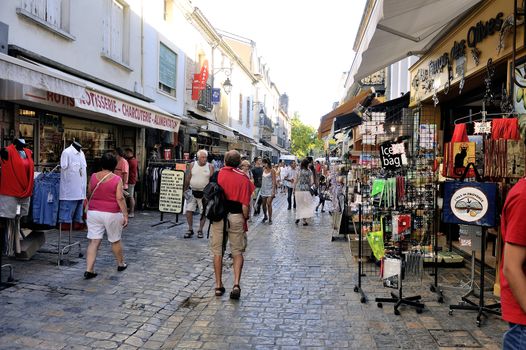 pedestrian shopping Aigues-Mortes in Camargue street in south-eastern France