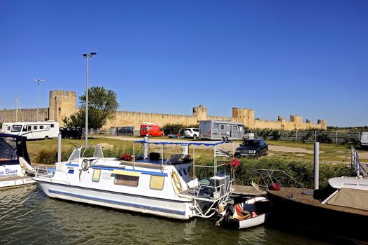 The marina of Aigues-Mortes in the background with the city walls.