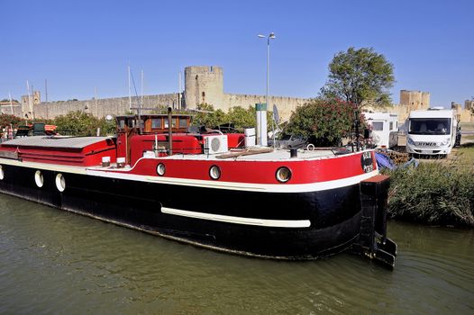 The marina of Aigues-Mortes in the background with the city walls.