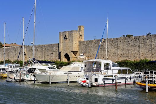 The marina of Aigues-Mortes in the background with the ramparts of the city.