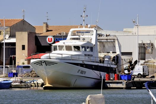 Trawler docked in the port of Le Grau-du-Roi in the Camargue, the port located in the city center just before the super market