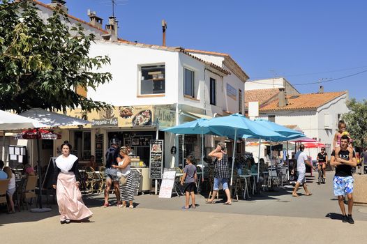 coffee shop in the city center of Saintes-Maries-de-la-Mer in the summer.